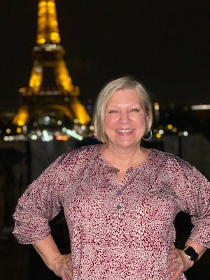 Tracey Wonnacott, Owner of Lavender Hill Designs, in front of the Eiffel Tower